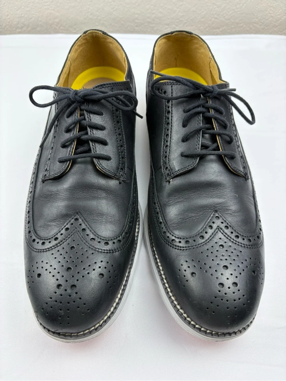 Cole Haan Original Grand wingtip Oxford shoes in black leather.